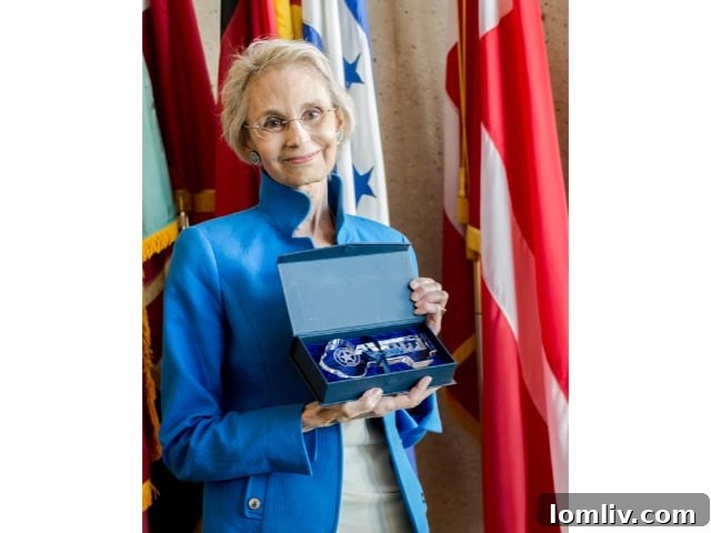 Virginia Savage McAlester: Guardian of Heritage, Chronicler, and Advocate for Change 5 Virginia Savage McAlester proudly holding the Key to the City of Dallas award