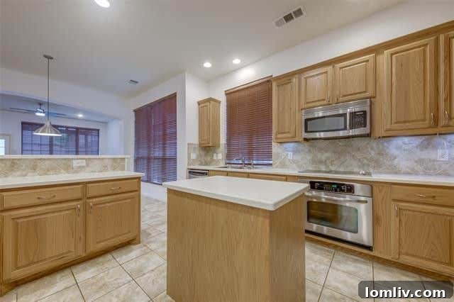 Open concept living and dining rooms in a Grand Prairie home, showcasing space for entertaining