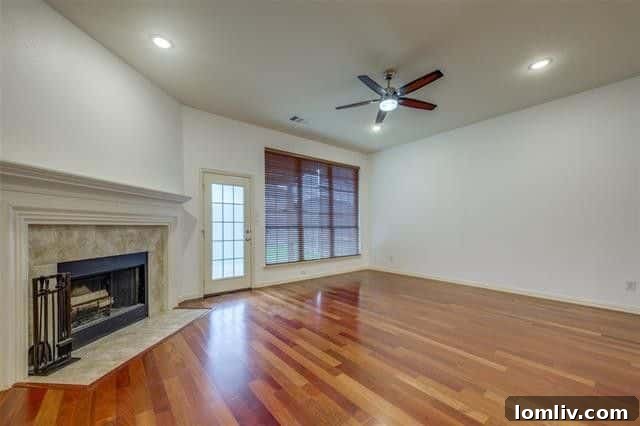 Modern kitchen with granite countertops, stainless steel appliances, and breakfast bar