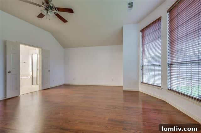 Spacious living room with a fireplace and access to the backyard, perfect for family gatherings