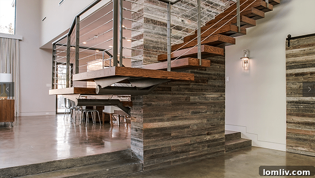 Staircase made with reclaimed wood, a prominent sustainable design theme in New Leaf Custom Homes