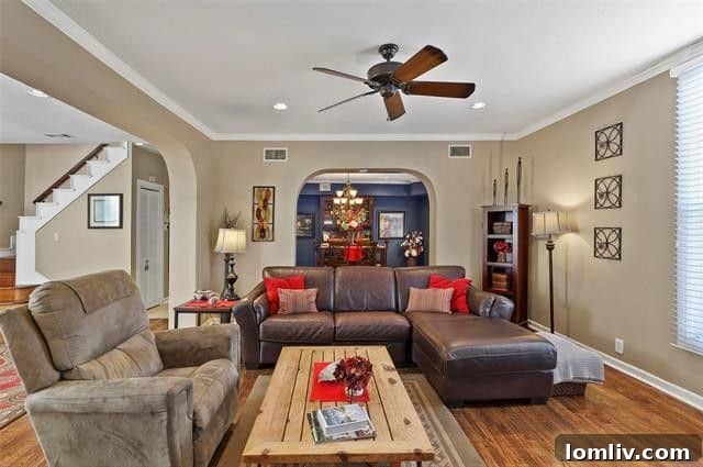 Charming dining room with archways and modern light fixture