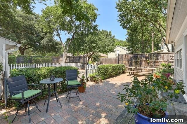 Lush backyard patio with seating, ideal for entertaining in Dallas