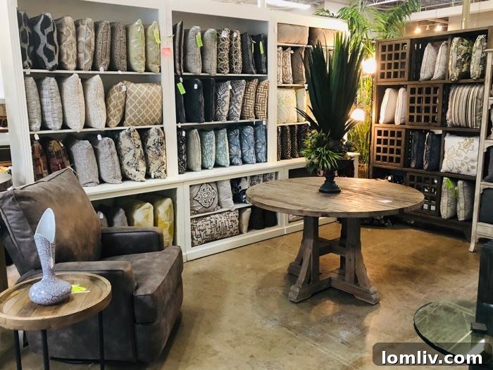 An inviting vignette featuring stylish chairs, unique accent tables, and sophisticated lighting, showcasing the diverse range of home furnishings available at this Dallas estate sale.