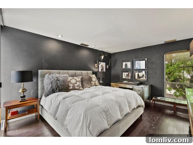 Elegant bedroom with sophisticated decor in the renovated mansard home