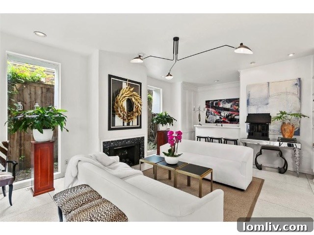 The elegantly renovated living room featuring a stylish built-in bar, perfect for entertaining