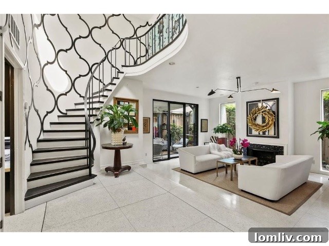 Close-up of the stunning custom-designed staircase with laser-cut PVC overlay, resembling metal