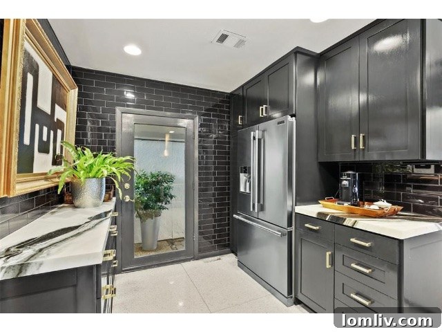 A contemporary black kitchen with elegant fixtures and streamlined design in the renovated mansard home