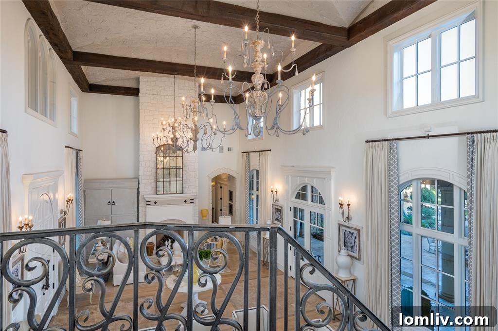 Elegant dining area with high ceilings and dual chandeliers, perfect for entertaining in Jason Witten's former home.