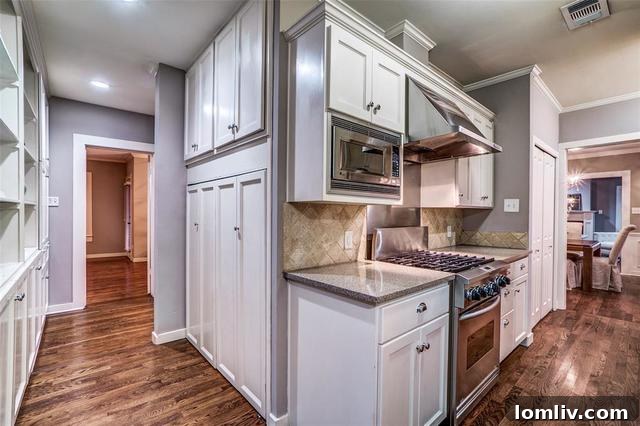 Modern kitchen with professional-grade appliances and butler's pantry at 5723 Monticello Ave