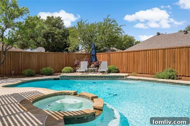 Discover Your Green Oasis in Plano 8 Inviting backyard pool area with a covered patio, perfect for outdoor entertainment in Plano, Texas.