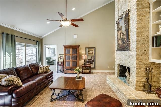 Spacious Living Area with Floor-to-Ceiling Brick Fireplace