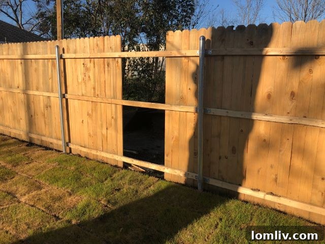 Fence cut to remove dishwasher from vacant home