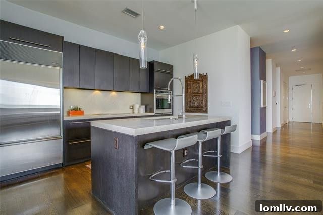 Close-up of the elegant marble countertop and professional Wolf gas range in the kitchen.