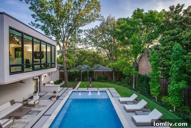 Luxurious swimming pool area of the Highland Park modern home.