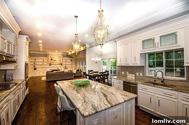 Three Homes From Another Dimension: Limitless Possibilities 15 Well-appointed kitchen with an island and high-end appliances.