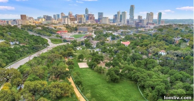 Aerial view of the 1715 Enfield Road property and its surrounding lush, historic Austin neighborhood.