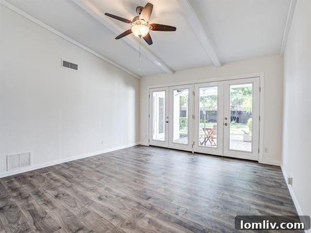 Modern and inviting dining area with engineered wood flooring, adjacent to a renovated kitchen, ideal for family meals and entertaining.
