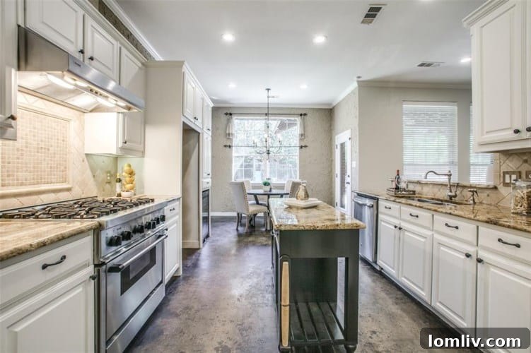 Masterfully Designed Oasis: Year-Round Splendor Awaits 7 Gourmet Kitchen with Thermador Range - Dallas Home