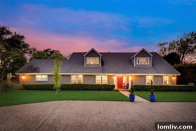 Stately exterior of 11717 Welch Road, North Highlands Estates, Dallas, featuring a circular driveway