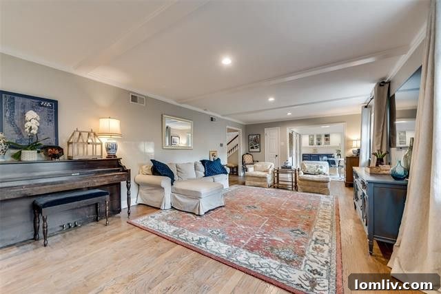 Kitchen island and herringbone wood floors, showcasing the open concept of 11717 Welch Road