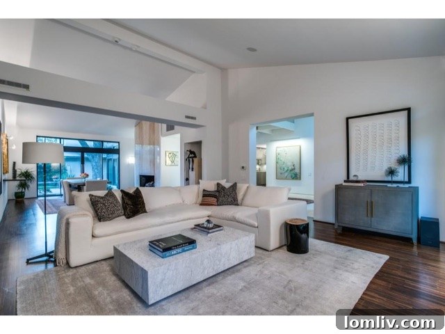 Grand foyer with floating staircase at 3601 Euclid Avenue