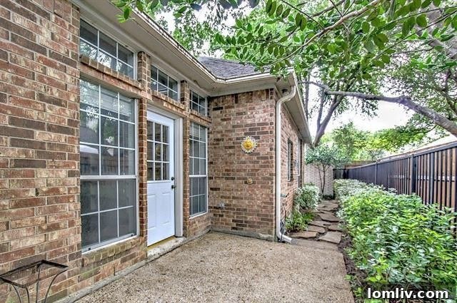 Well-maintained backyard with a cozy patio space, perfect for outdoor relaxation and enjoyment in the Forest Hills 'Steal' home
