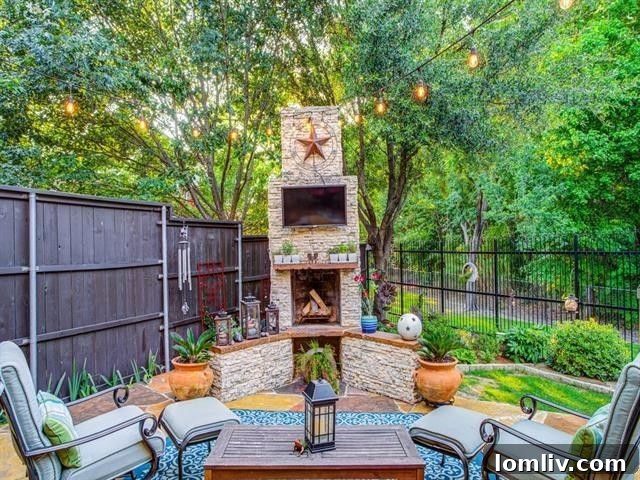 Expansive outdoor patio with a charming stone fireplace and comfortable seating overlooking a lush greenbelt in Forest Hills