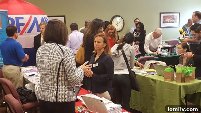 Professionals networking at a real estate career fair