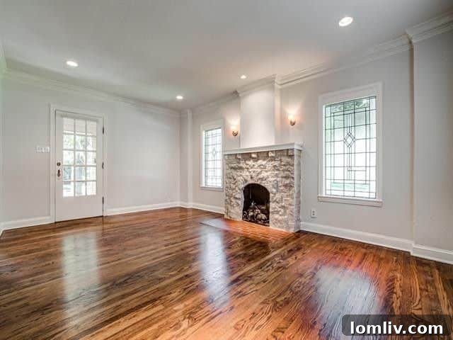 Expansive green lawn of a corner lot surrounding a charming Tudor home