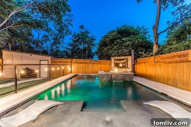 Inviting Pool Area with Outdoor TV and Firepit in Lake Highlands Home