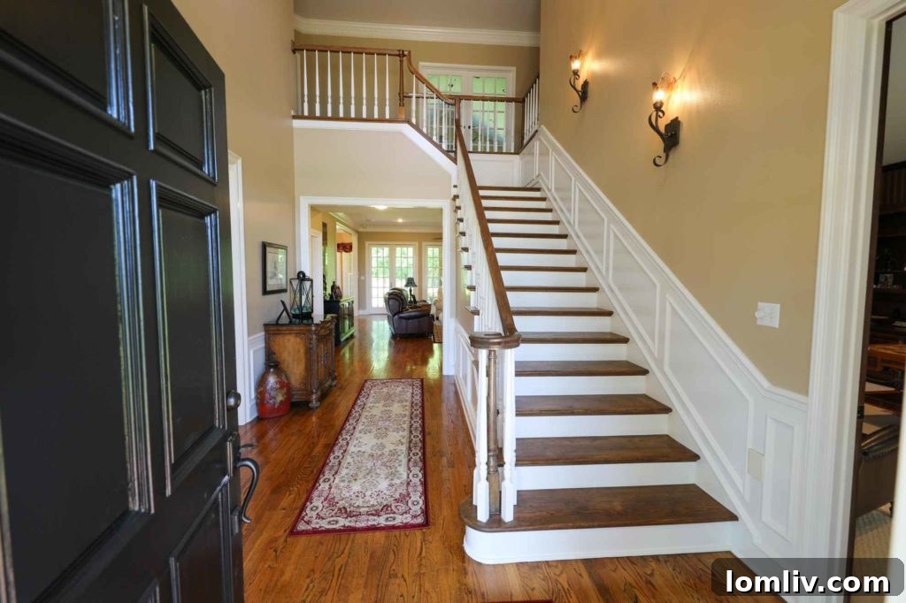 Bright and welcoming entry foyer with hardwood floors