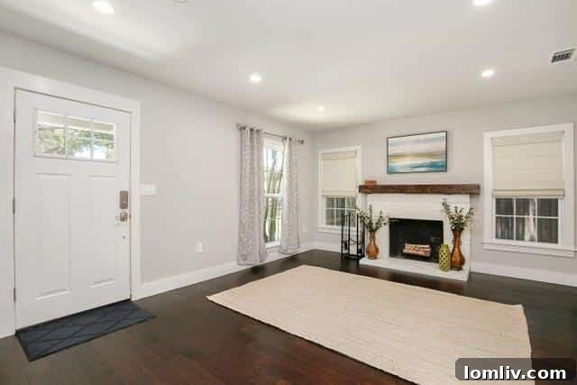 Bright white modern kitchen with quartz countertops, custom cabinetry, and stainless steel appliances.