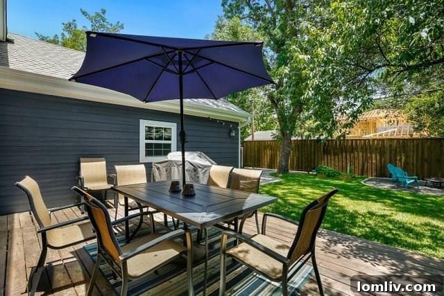 Charming dining area with elegant lighting, hardwood floors, and abundant natural light.