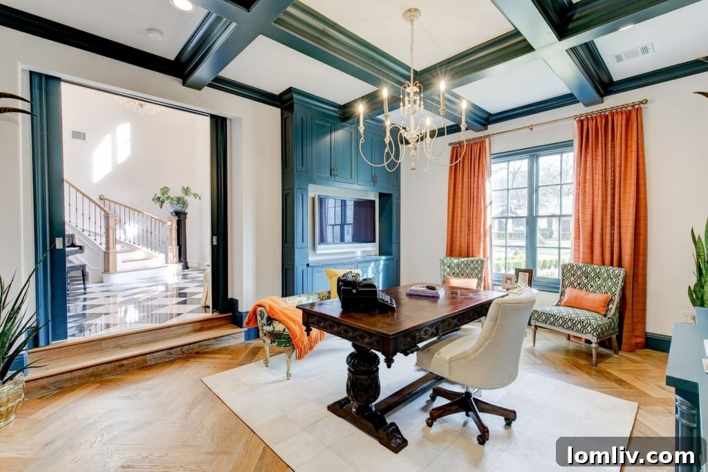 Luxurious grand foyer with floating serpentine staircase and classic marble floors