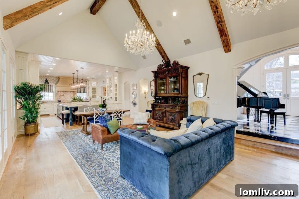 Elegant home study featuring deep French blue woodwork, ceiling beams, and saffron curtains