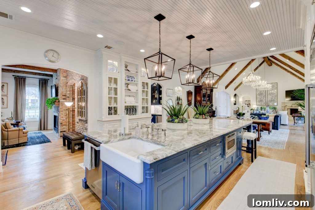 Spacious great room with soaring cathedral ceilings, rustic beams, and white oak floors