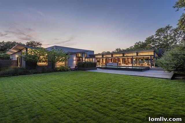 Signature Texas Modern: An AIA Dallas Tour Residence 24 Architectural lighting illuminating the pool area at night