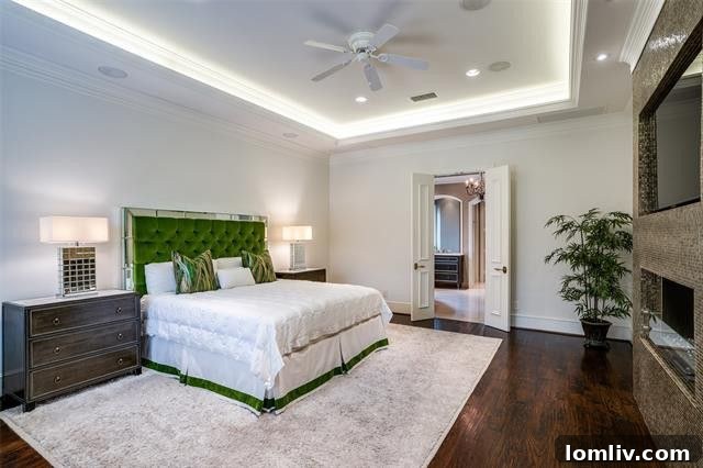 Preston Hollow Mansion: A Beauty Icon's Former Residence 10 Luxurious primary bedroom in a Preston Hollow residence