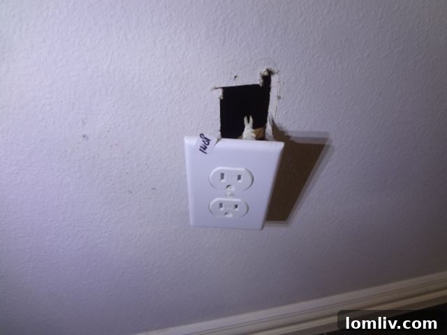 Faulty electrical outlet with exposed wires