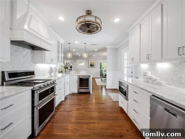 Stunning kitchen featuring Carrara marble countertops and stainless steel appliances