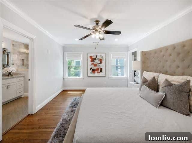 Luxurious master bedroom with plush carpeting and ample natural light