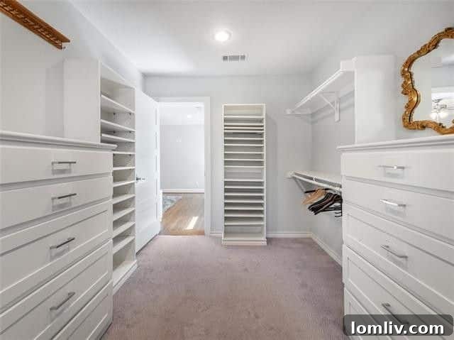 Spacious walk-in closet in the master suite with custom shelving