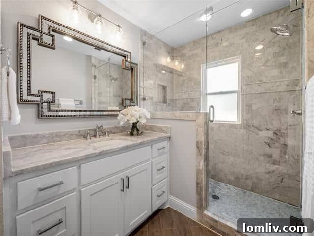 Elegant master bathroom with marble details and modern fixtures
