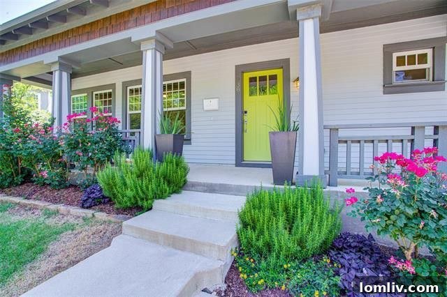 Elegant Craftsman exterior with inviting front porch and landscaping