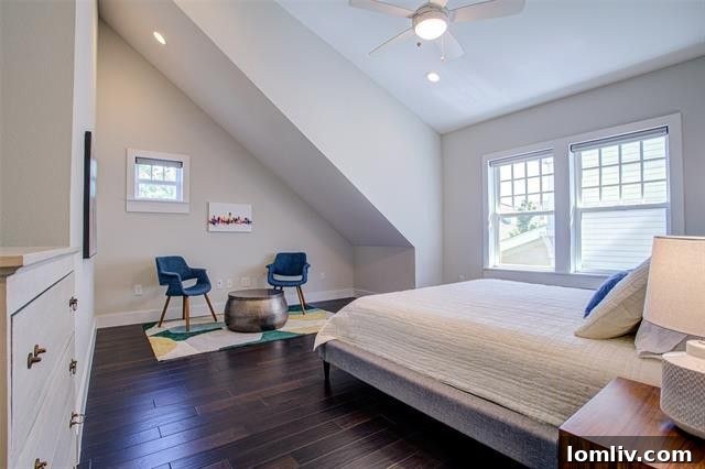 Spacious and serene master bedroom with ample natural light