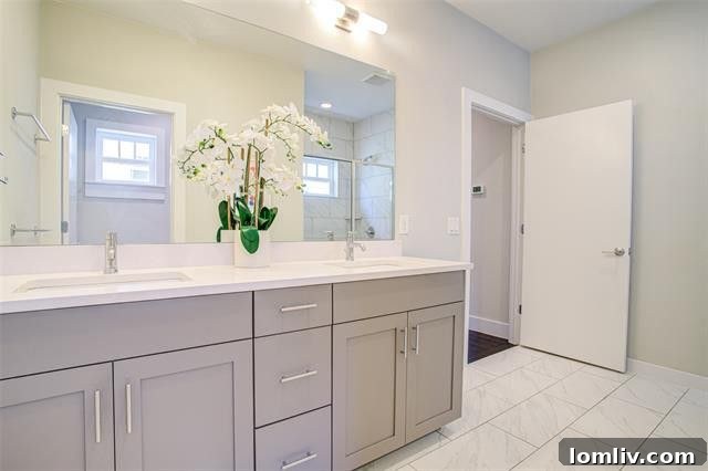 Luxurious master bathroom with designer tiles and modern fixtures