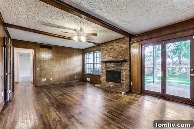 Inviting living room with a brick fireplace and bay window