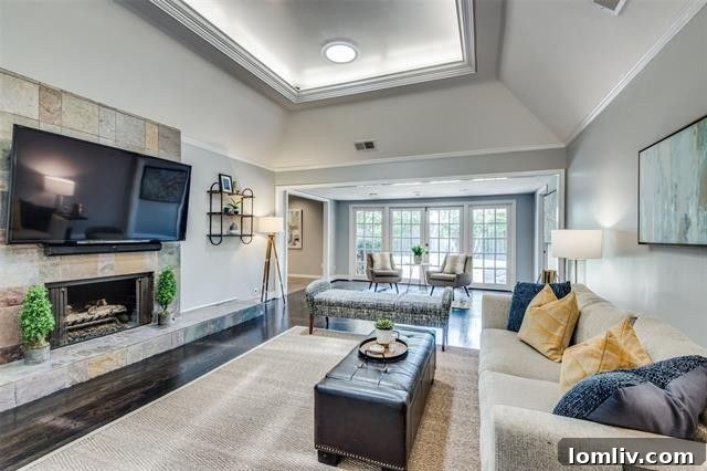 Spacious Living Area with Fireplace and Natural Light