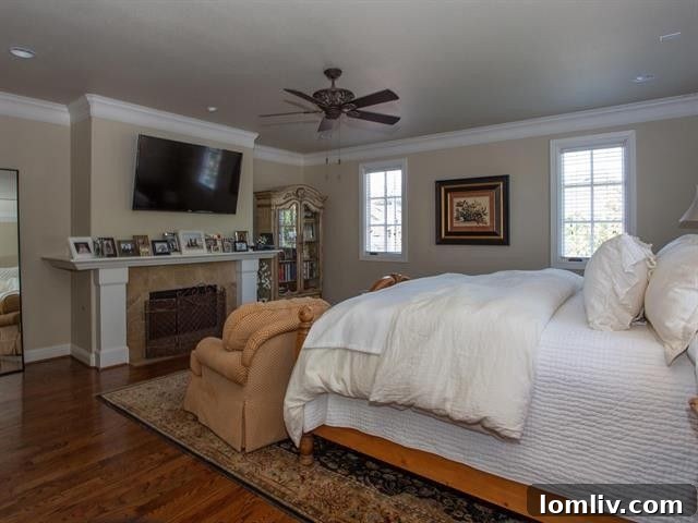 Spacious primary bedroom with fireplace in Fort Worth townhouse